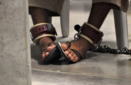 FILE PHOTO: File photo of Guantanamo detainee's feet shackled to the floor as he attends a "Life Skills" class at Guantanamo Bay U.S. Naval Base