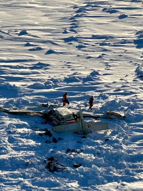 Authorities inspect the wreckage of the Cessna 208B Grand Caravan aircraft operated by Berring Air, near Nome