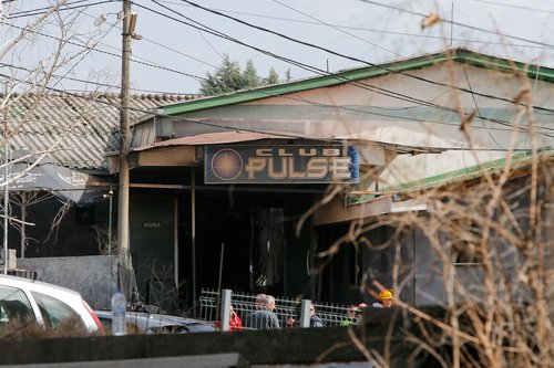 Rescue crews operate outside a night club, following a fire resulting in casualties, in the town of Kocani