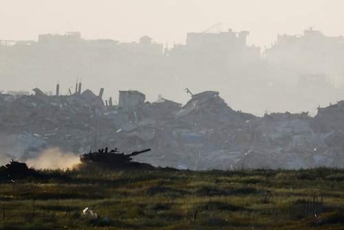 A tank manoeuvres inside Gaza, as seen from Israel's border with Gaza