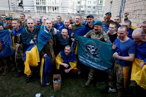 Ukrainian prisoners of war (POWs) return after a swap, at an undisclosed location
