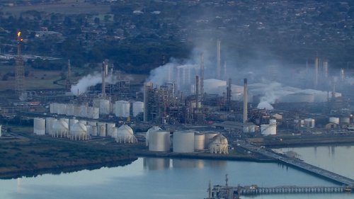 An aerial view shows smoke rising following a fire at Viva Energy Group's refinery in Geelong, Australia