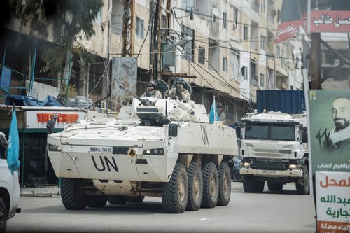 A UNIFIL convoy rides through the town, as seen through the window of a vehicle, in Tyre, south Lebanon, April 15, 2026.