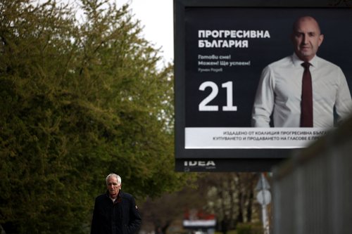 A man walks past an election billboard of the Progressive Bulgaria coalition's leader and former President Rumen Radev, ahead of the snap election, in Sofia, Bulgaria, April 14, 2026. REUTERS/Spasiyana Sergieva