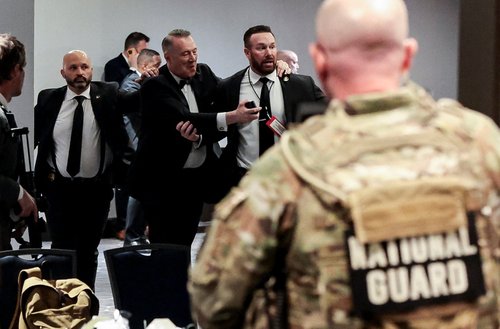 Security officials evacuate guests as a shooter opens fire during the annual White House Correspondents' Association dinner in Washington, D.C., U.S., April 25, 2026. REUTERS/Jonathan Ernst