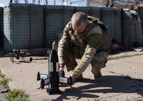 A serviceman of air defence unit of the 24th Separate Mechanized Brigade of the Ukrainian Armed Forces prepares a P1-Sun FPV interceptor drone for a launch near the frontline, amid Russia's attack on Ukraine, in Donetsk region, Ukraine