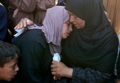Mourners react during the funeral of Palestinian child Adel Al-Najjar, who was killed today in an Israeli strike, according to medics, at Nasser Hospital in Khan Younis, in the southern Gaza Strip