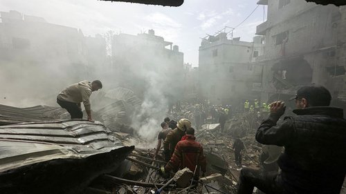 People gather as rescuers work at the site of an Israeli strike, amid escalating hostilities between Israel and Hezbollah, as the U.S.-Israel conflict with Iran continues, in the Jnah area in Beirut, Lebanon, April 5, 2026.