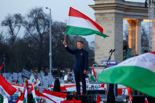 FILE PHOTO: Peter Magyar, leader of the opposition Tisza party, holds a Hungarian flag during Hungary's National Day celebrations, which also commemorates the 1848 Hungarian Revolution against Habsburg rule, in Budapest, Hungary, March 15, 2026.