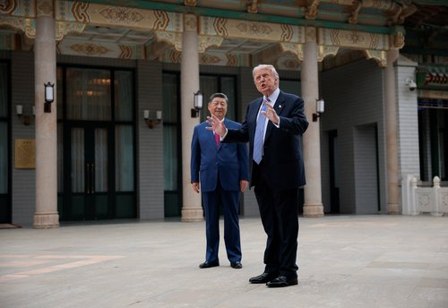 U.S. President Donald Trump gestures as he speaks next to Chinese President Xi Jinping during a visit to the Zhongnanhai Garden in Beijing, China, May 15, 2026. REUTERS/Evan Vucci/Pool