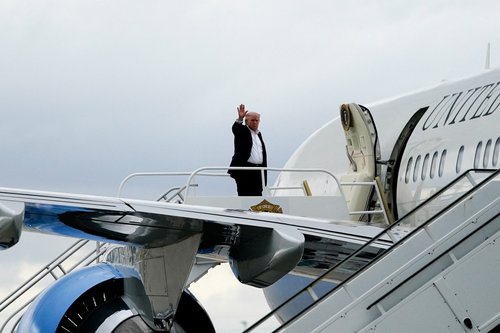 U.S. President Donald Trump boards Air Force One en route to Washington, D.C., while departing from Miami International Airport in Florida, U.S., May 3, 2026.