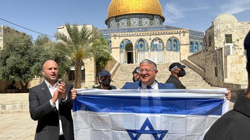 Israeli National Security Minister Itamar Ben-Gvir holds an Israeli flag at the Al-Aqsa compound, known to Jews as the Temple Mount, on Jerusalem Day, in Jerusalem's Old City, May 14, 2026.