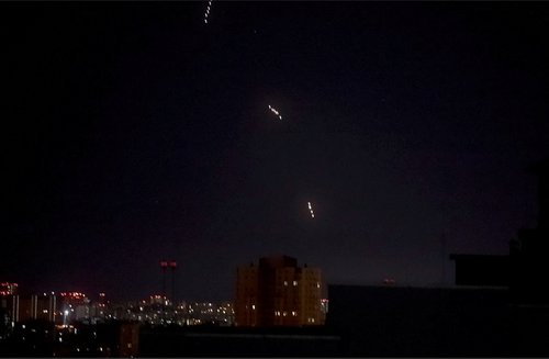 Russian missiles, which appear to be the Oreshnik hypersonic ballistic missile, according to the Ukrainian Air Force, fly during a Russian missile and drone strike, amid Russia's attack on Ukraine, in Kyiv, Ukraine in this screen grab
