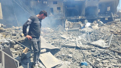 A man inspects the site of an Israeli strike in Tyre, Lebanon, May 28, 2026.