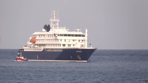 A boat beside cruise ship MV Hondius anchored off Cape Verde port, on the day sick passengers were evacuated by boat from the cruise ship, in Praia Port, Cape Verde, in this screengrab obtained from a video, May 5, 2026.