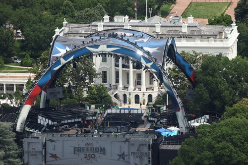 FILE PHOTO: Construction continues on a temporary arena that will host the UFC Freedom 250 fight card at the White House in Washington, D.C., U.S., June 9, 2026. REUTERS/Kevin Lamarque/File Photo