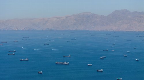 FILE PHOTO: A drone view shows vessels anchored at the Strait of Hormuz. REUTERS/Stringer/File Photo