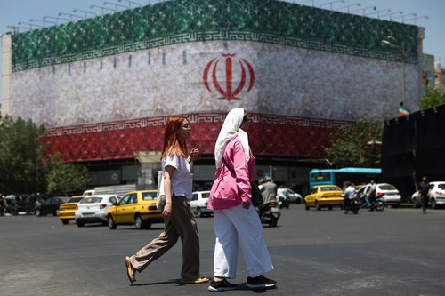 People walk on a street in Tehran, Iran, June 14, 2026.