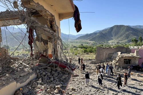 People gather near a destroyed building after an attack, which the Taliban say was an airstrike carried out by Pakistan's security forces, in Samkani District, Paktia Province, Afghanistan, June 29, 2026.