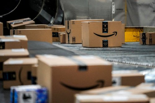An Amazon box moves along a conveyor belt at Amazon?s fulfillment center in Robbinsville, New Jersey, U.S., December 1, 2025.