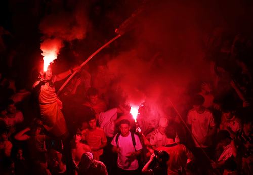 Soccer Football - FIFA World Cup 2026 - Final - Spain v Argentina - Fans gather in Madrid - Madrid, Spain - July 19, 2026 Spain fans light flares as they celebrate at Plaza de Cibeles in Madrid after Spain win the FIFA World Cup final against Argentina