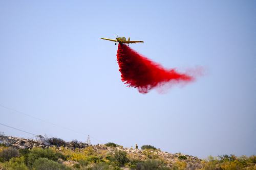 An aircraft releases fire retardant during efforts to extinguish a deadly wildfire near Almocaizar, Almeria, Spain, July 12, 2026.
