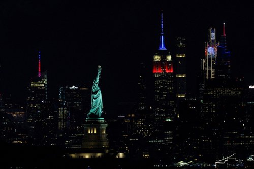 The Statue of Liberty and The Empire State Building are illuminated as the United States celebrates its 250th anniversary on Independence Day in New York City, U.S., July 4, 2026. EUTERS/Brendan McDermid