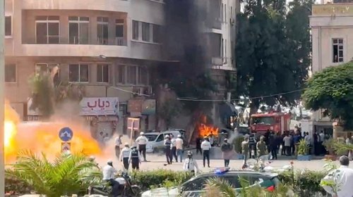 Smoke and fire rise at the site where explosive devices blew up near a hotel where French President Emmanuel Macron was meant to be staying, in Damascus, Syria, in this screengrab obtained from a video, July 7, 2026. REUTERS/Yamam Al Shaar