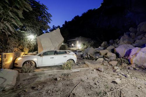 A view shows a damaged vehicle among boulders and debris after a magnitude 4.7 earthquake struck the Campi Flegrei area, in Pozzuoli, near Naples, Italy, July 31, 2026. REUTERS/Salvatore Laporta