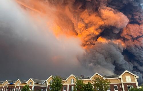Smoke billows from the burning Wildberries warehouses. REUTERS/Stringer