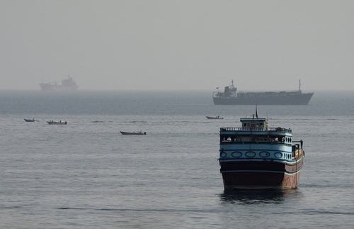 FILE PHOTO: Vessels in the Strait of Hormuz, as seen from Musandam, Oman, August 3, 2026. REUTERS/Stringer/File Photo