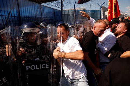 Protesters scuffle with riot police outside the European Union Rule of Law Mission in Kosovo (EULEX) headquarters in Pristina, Kosovo September 16, 2026. REUTERS/Valdrin Xhemaj