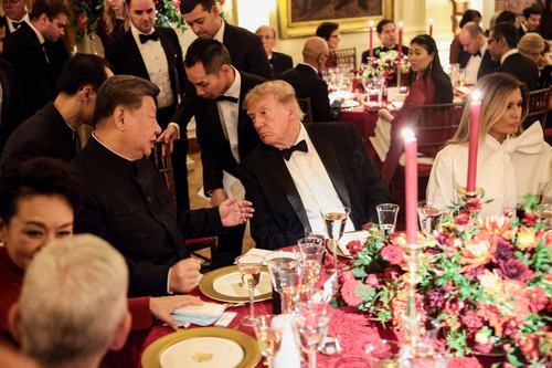 Chinese President Xi Jinping and US President Donald Trump speak during a state dinner at the White House in Washington, D.C., US