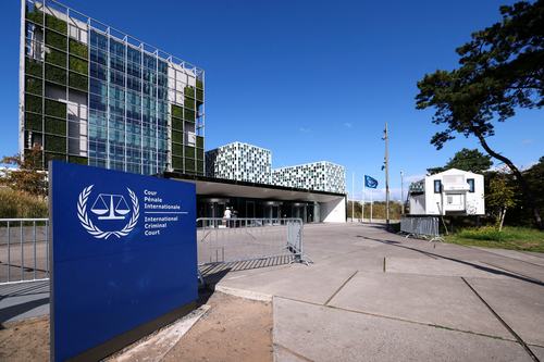 People stand outside the International Criminal Court in The Hague, Netherlands, September 22, 2025.