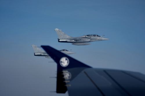 Two French Air Force Dassault Rafale C fighter jets are seen through a window of the aircraft carrying Pope Leo XIV from Lourdes to Metz on the last day of his four-day visit to France, Monday, Sept. 28, 2026.