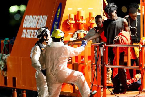 Rescuers help a migrant disembarking from a Spanish coast guard vessel at the port of Arguineguin, on the island of Gran Canaria, Spain, September 3, 2026.