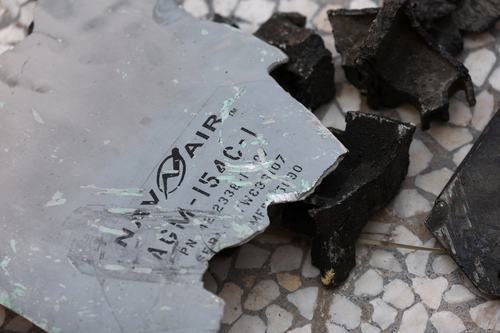 Fragments believed to be from military equipment lie near damaged houses following a reported attack near a wedding gathering in Kuhestak, Sirik, Iran, September 4, 2026.