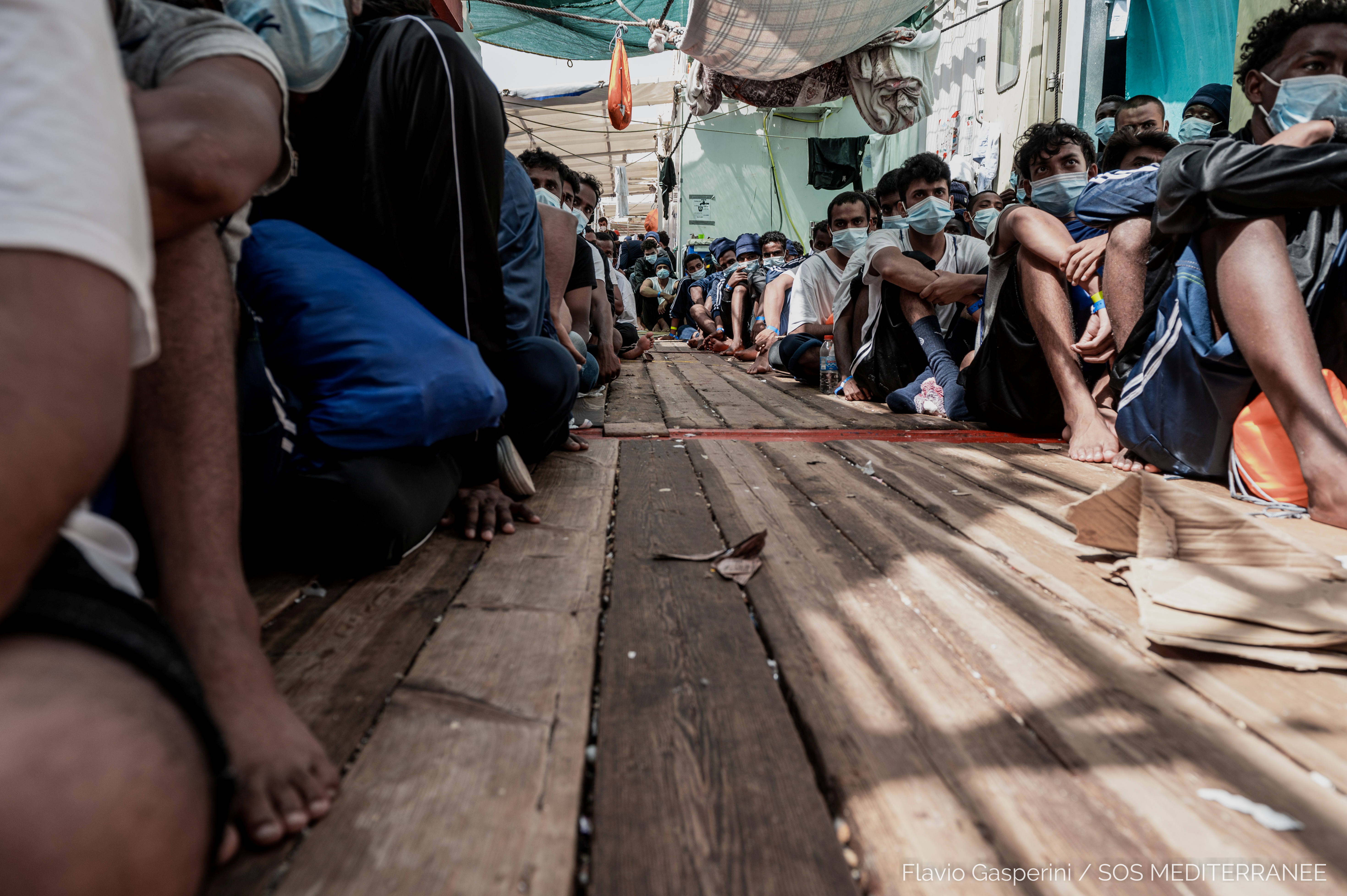 Migrants wait to disembark "Ocean Viking" ship, in Augusta