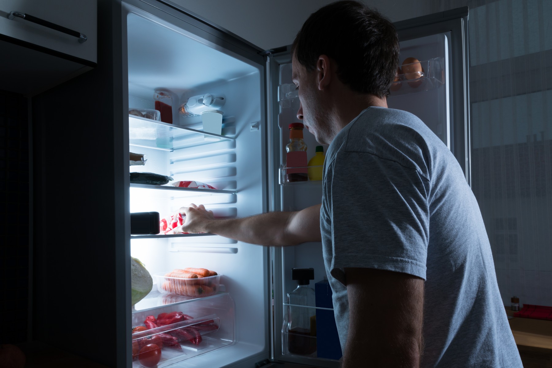Man Taking Food From Fridge