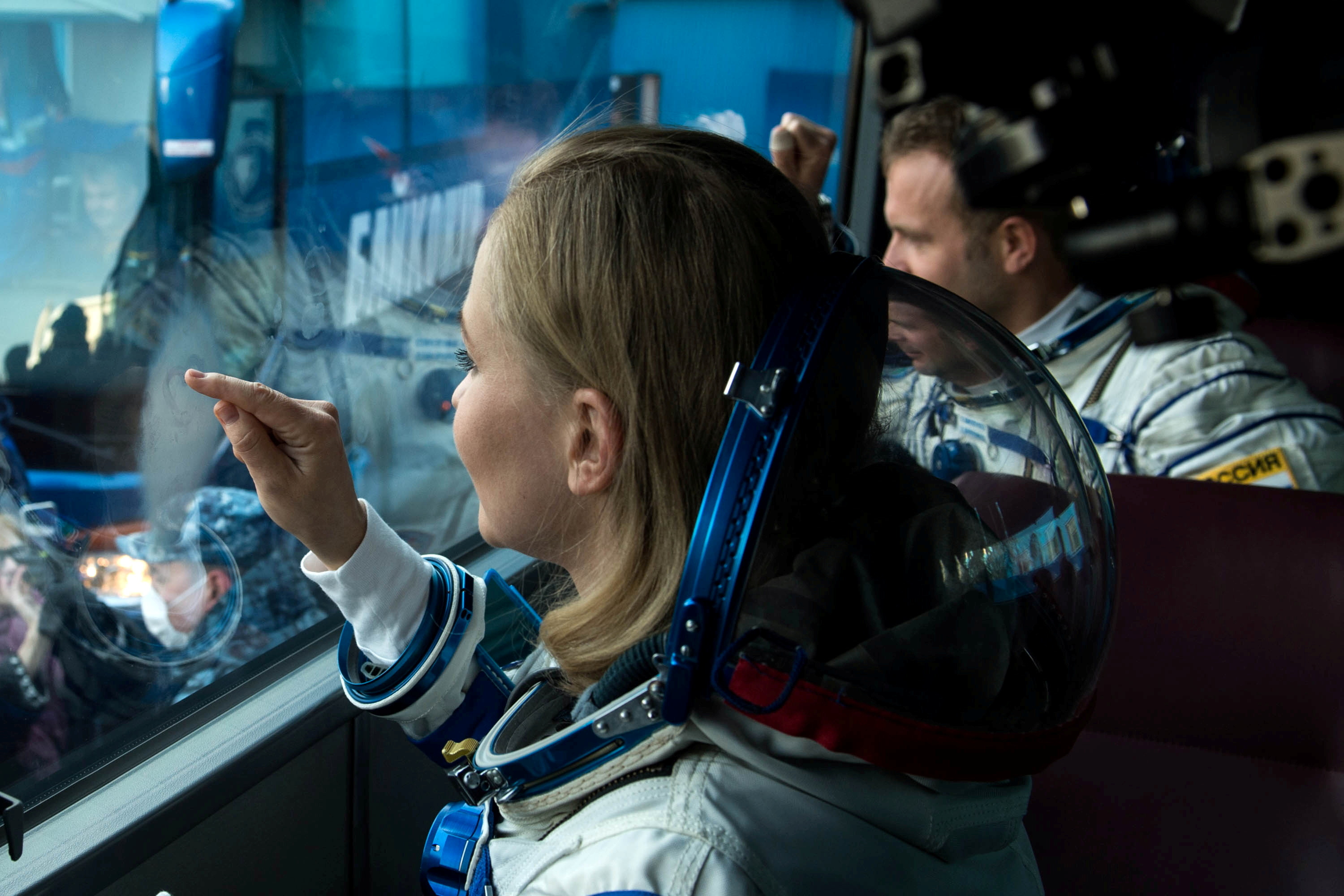 The International Space Station (ISS) crew members depart for boarding the Soyuz MS-19 before the launch at the Baikonur Cosmodrome