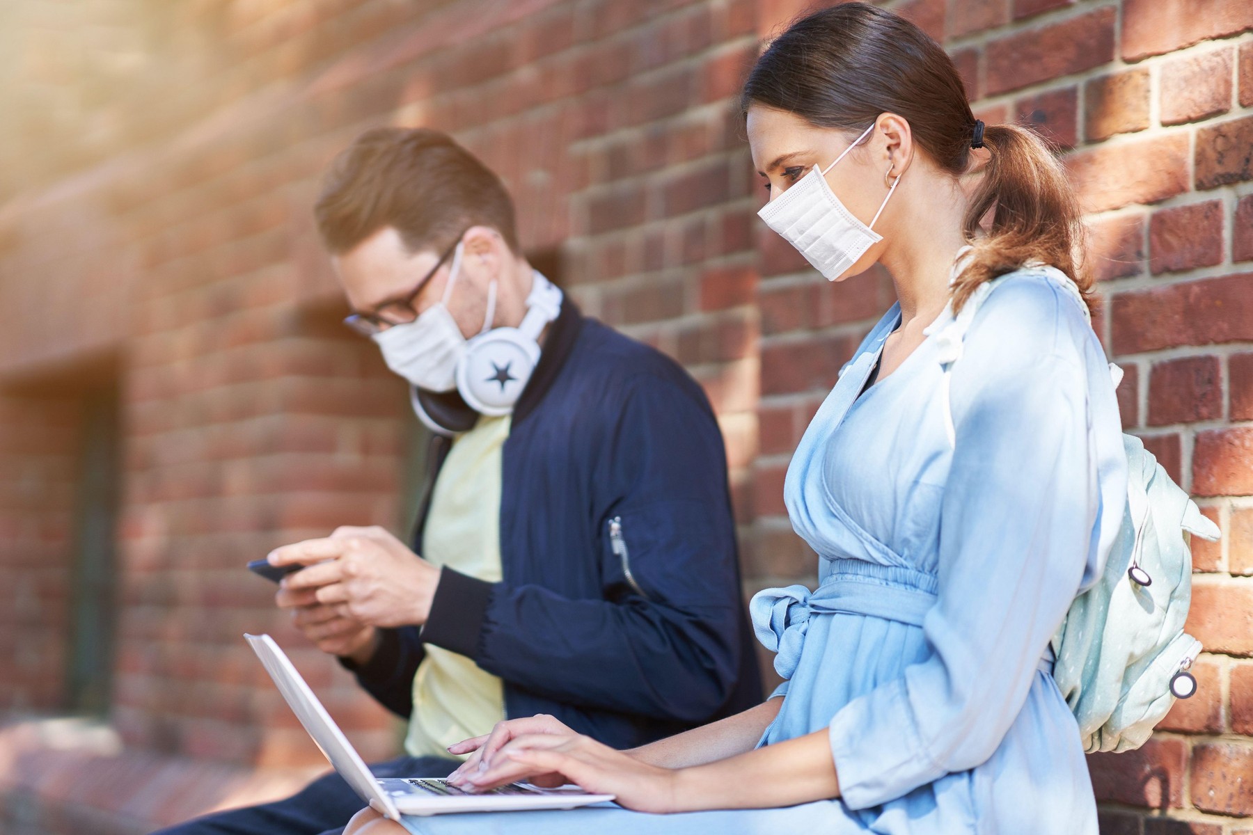 Couple of students in the campus wearing masks due to coronavirus pandemic