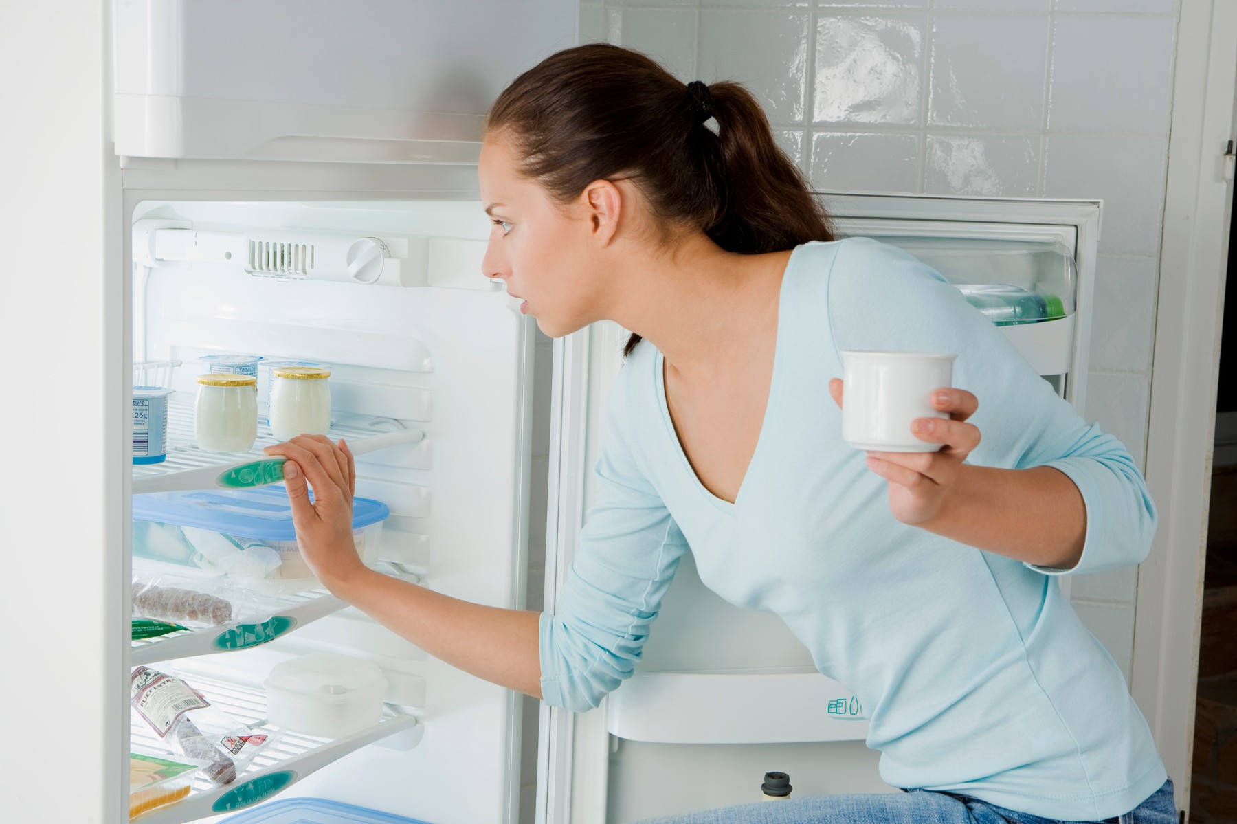 Woman looking in the fridge