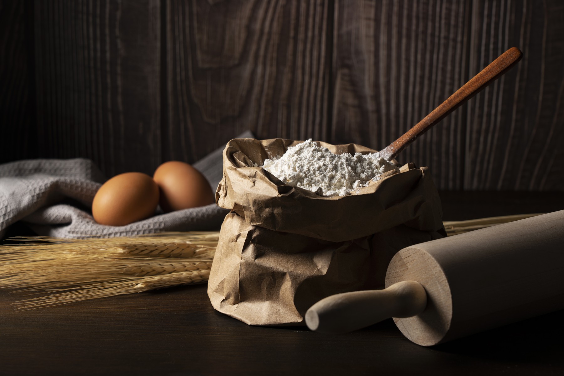 Flour set against a dark wooden background