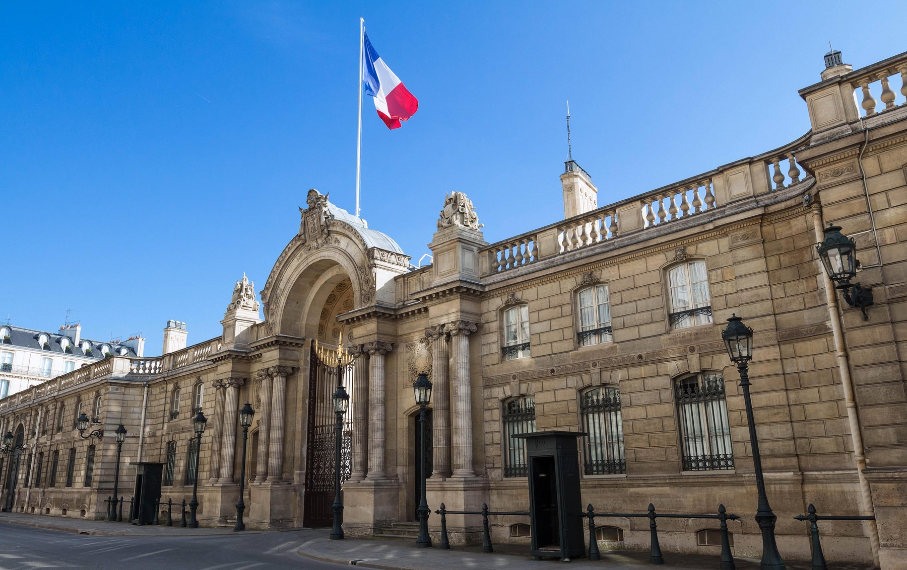 View of entrance gate of the Elysee Palace from the Rue du Faubourg Saint-Honore. Elysee Palace - official residence of President of French Republic s