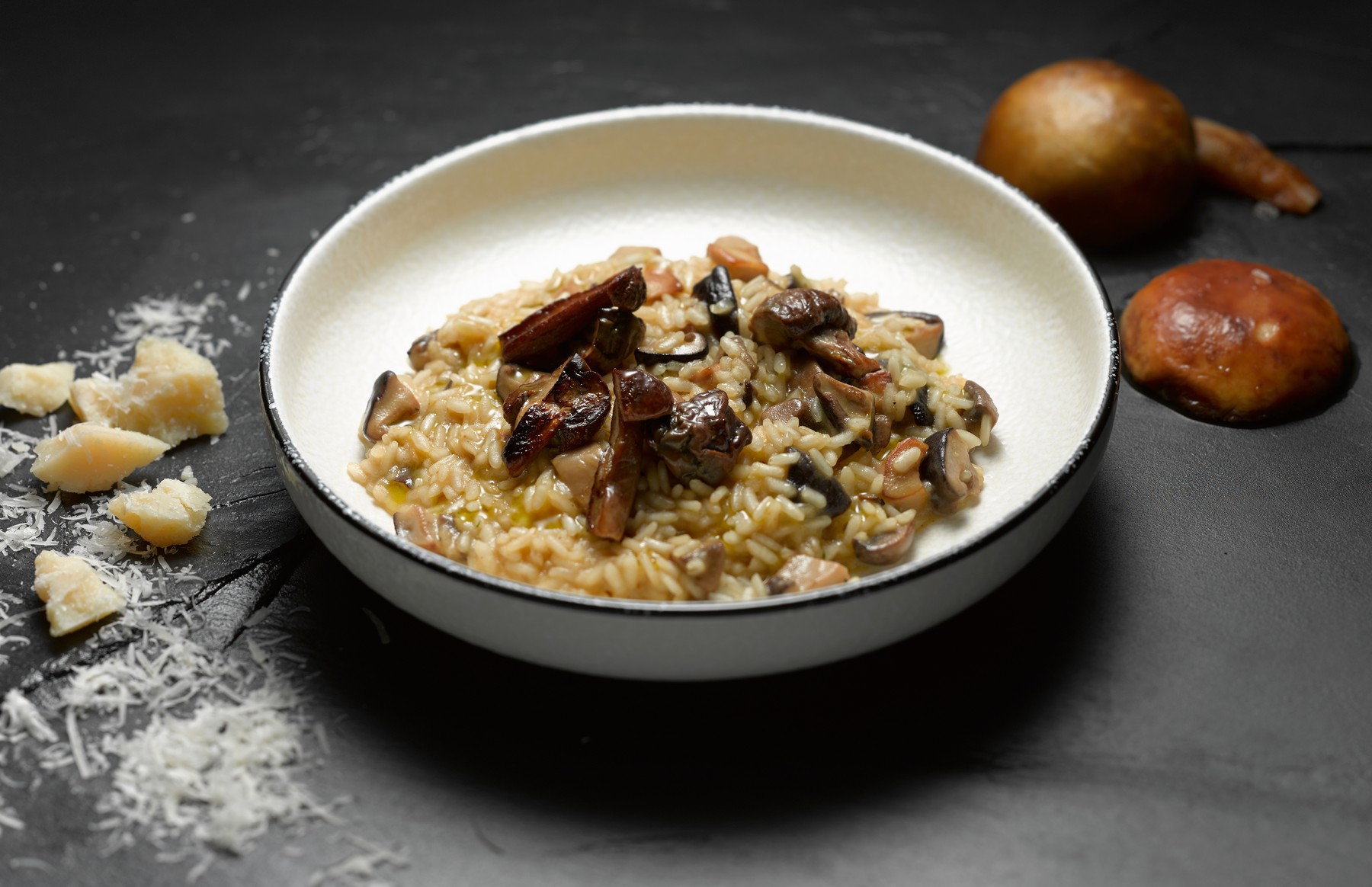 High angle view of mushroom risotto in shallow bowl