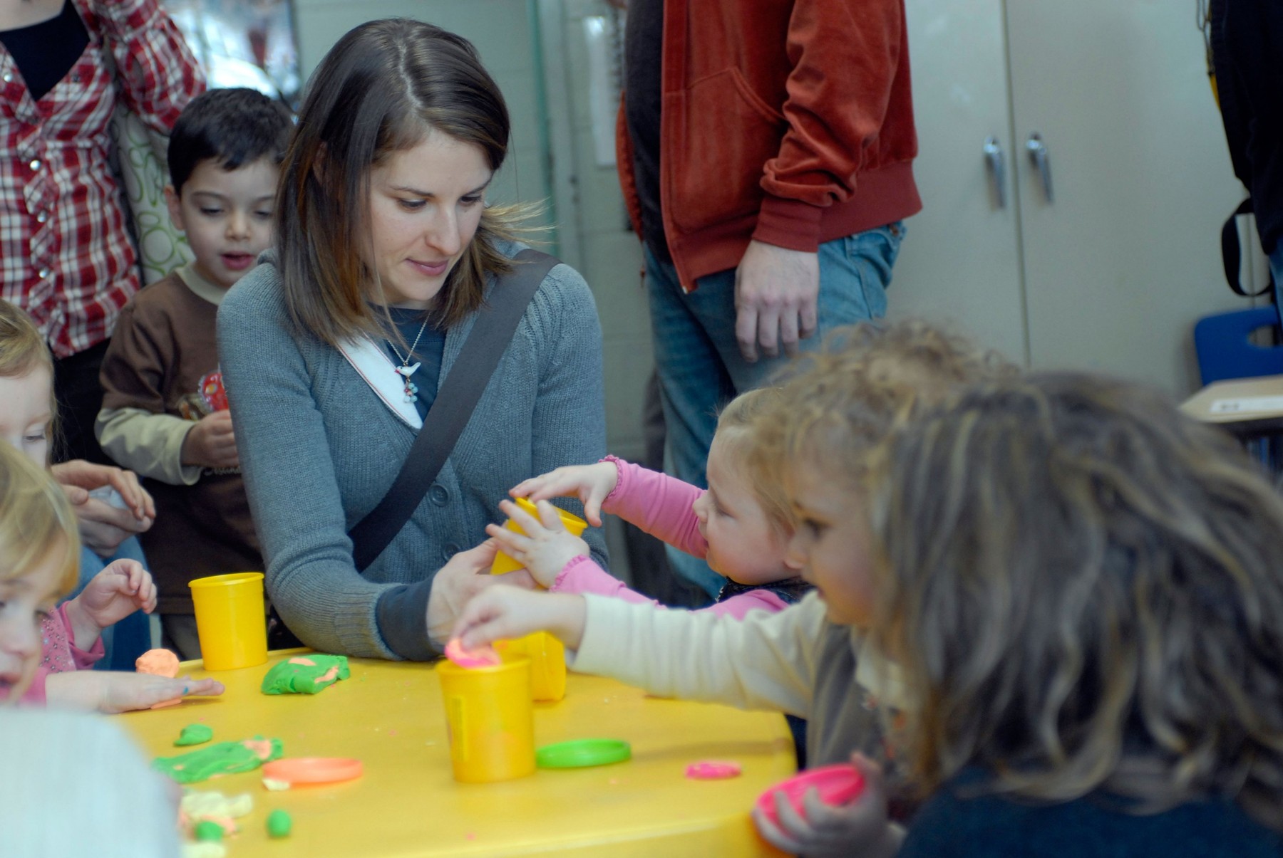 Parents entertain their children with Play Doh at a family event in NYC