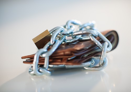 A padlock and chain around a wallet