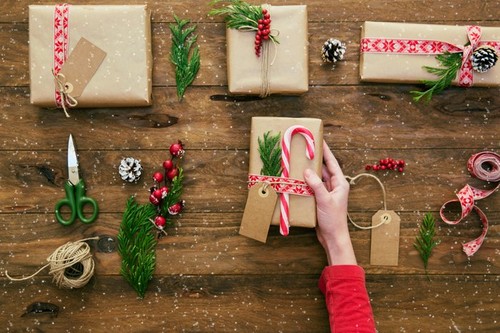 Girl wrapping Christmas gifts