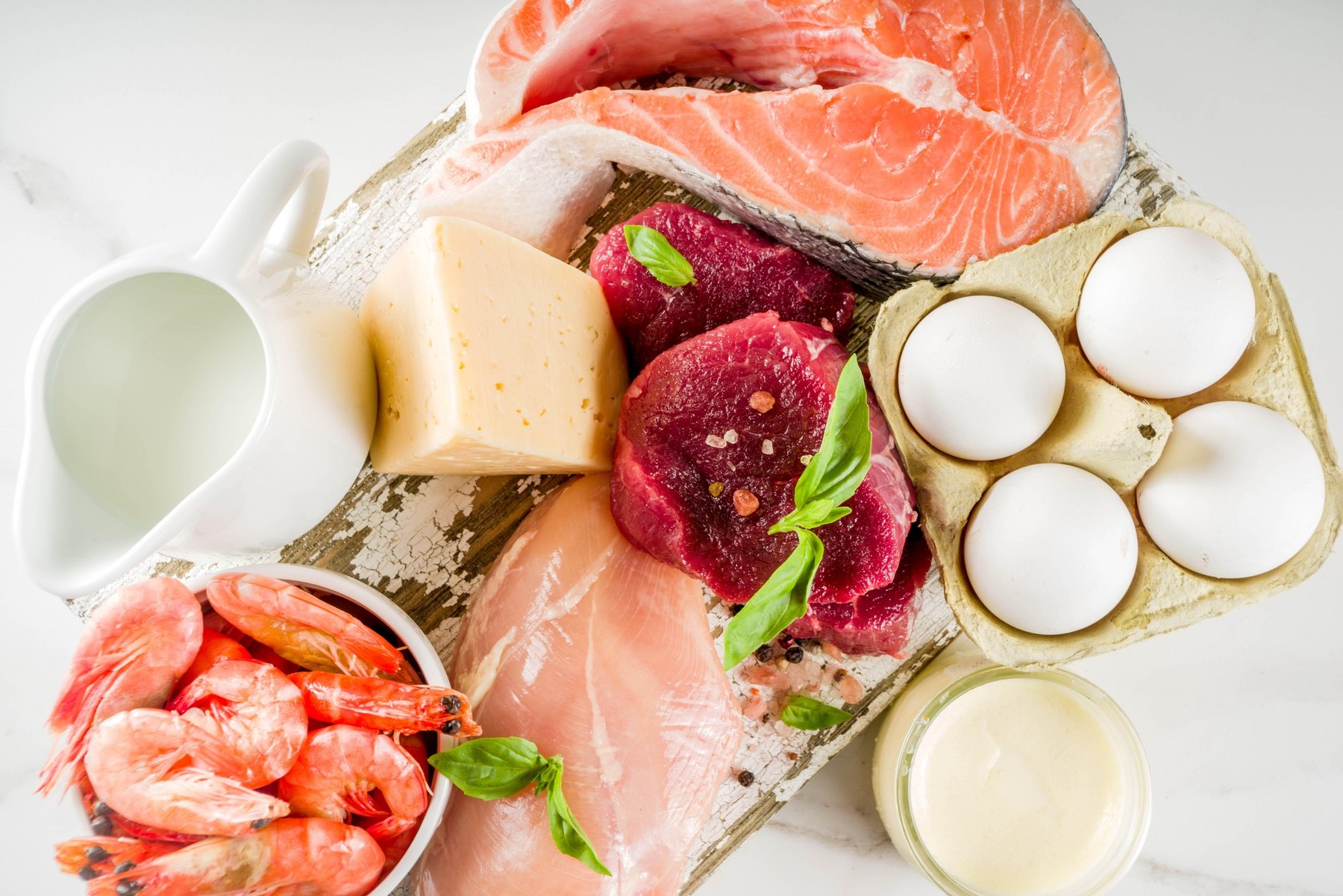 Animal protein sources - raw beef meat steak, chicken breast fillet, salmon fish, eggs, dairy milk, shrimps, cheese, copy space