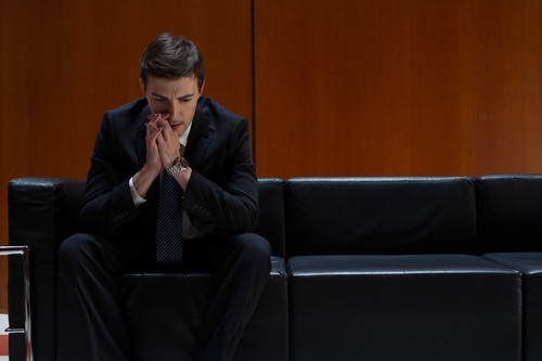 Job applicant nervously waiting for interview to begin